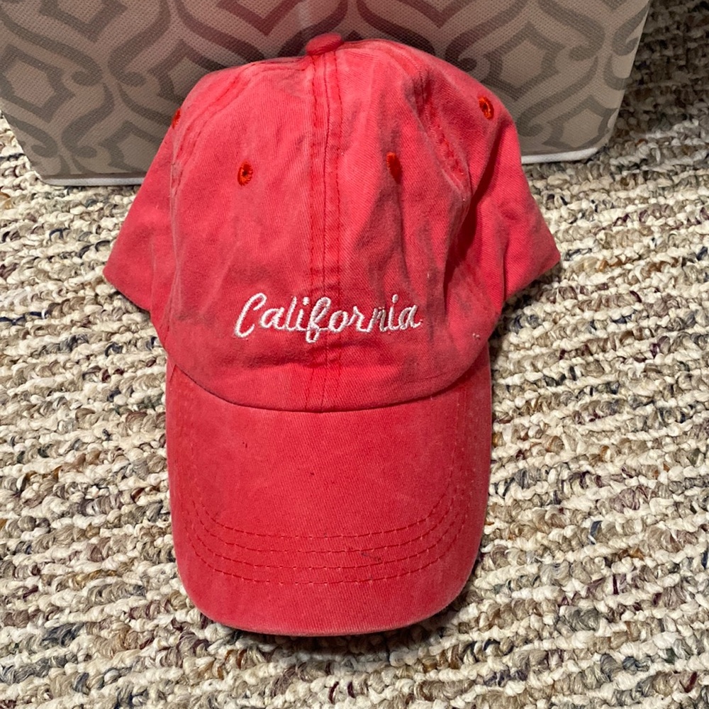 Faded look red baseball cap.